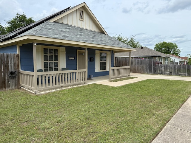 1253 E Ramsey Ave, Fort Worth, TX 76104 - view of front of home with covered porch, board and batten siding, concrete driveway, and roof with shingles