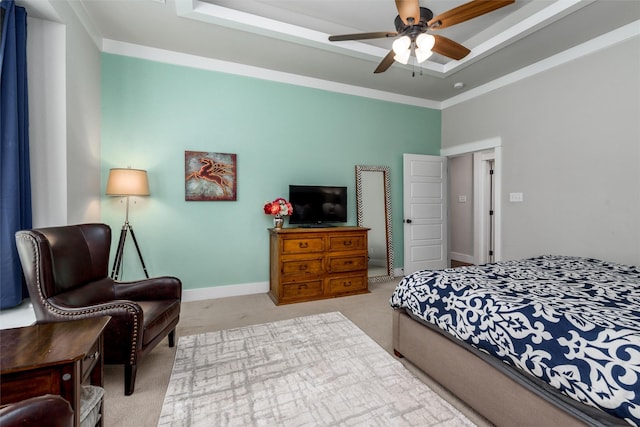 carpeted bedroom featuring baseboards, a ceiling fan, and ornamental molding