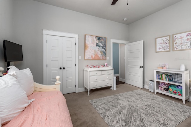 carpeted bedroom featuring a closet and a ceiling fan