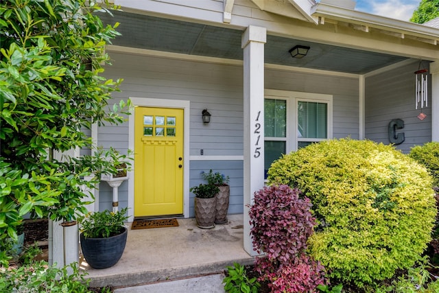 entrance to property featuring a porch