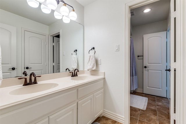7333 Valencia Grove Ct, Fort Worth, TX 76132 - bathroom with double vanity and baseboards