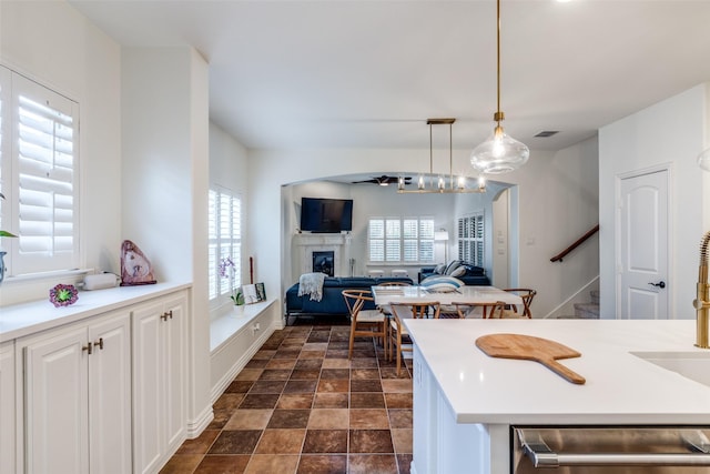 7333 Valencia Grove Ct, Fort Worth, TX 76132 - kitchen featuring dishwashing machine, healthy amount of natural light, open floor plan, and a fireplace