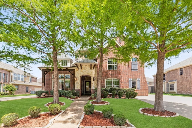 509 Wentworth Ln, Murphy, TX 75094 - view of front of house with a front lawn, brick siding, and stone siding