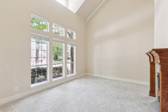 509 Wentworth Ln, Murphy, TX 75094 - unfurnished living room with carpet flooring, healthy amount of natural light, high vaulted ceiling, and baseboards