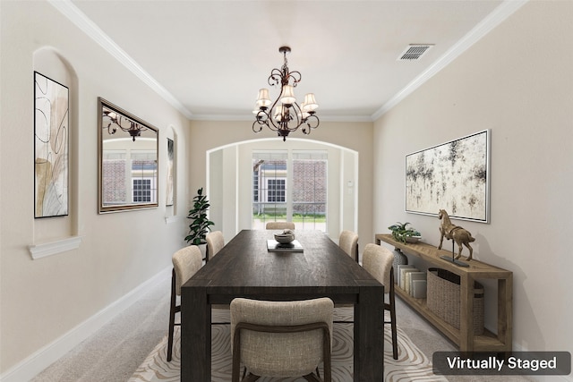 509 Wentworth Ln, Murphy, TX 75094 - dining space with light colored carpet, a chandelier, ornamental molding, baseboards, and arched walkways