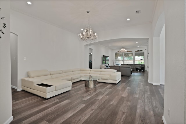 10108 Morning Glory Ln, Frisco, TX 75035 - living room with arched walkways, a chandelier, dark wood-style floors, baseboards, and recessed lighting