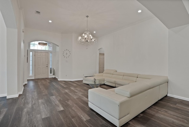 10108 Morning Glory Ln, Frisco, TX 75035 - living area featuring arched walkways, dark wood-style flooring, baseboards, recessed lighting, and a chandelier