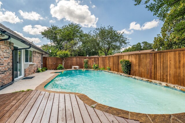 3301 Regent Dr, Plano, TX 75075 - view of pool featuring a fenced backyard and a wooden deck