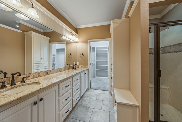 5524 Hollytree, Tyler, TX 75703 - bathroom featuring ornamental molding, double vanity, a spacious closet, a stall shower, and tile patterned flooring