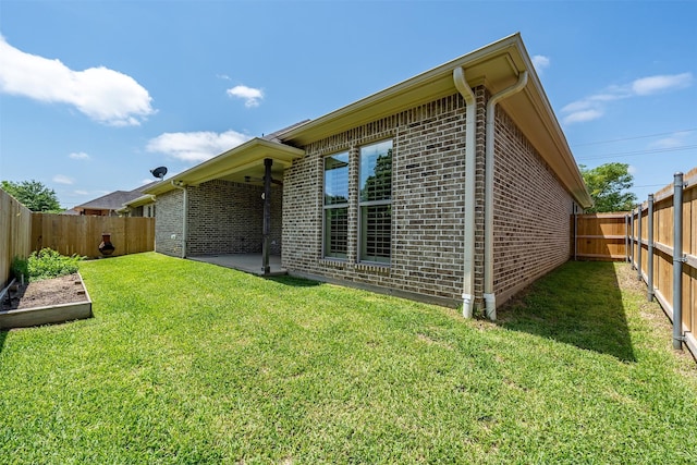 5524 Hollytree, Tyler, TX 75703 - view of side of property with brick siding and a patio