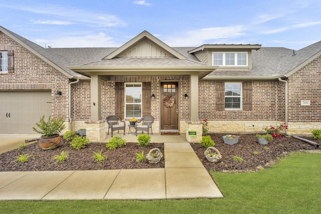 208 Beechcraft Ct, Caddo Mills, TX 75135 - view of front facade with brick siding, a shingled roof, covered porch, and concrete driveway