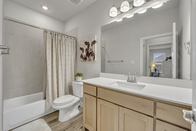 208 Beechcraft Ct, Caddo Mills, TX 75135 - bathroom featuring toilet, shower / bath combo, wood finished floors, and vanity