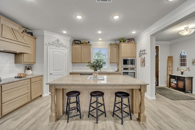208 Beechcraft Ct, Caddo Mills, TX 75135 - kitchen with light brown cabinets, appliances with stainless steel finishes, ornamental molding, a breakfast bar, and light wood-style floors