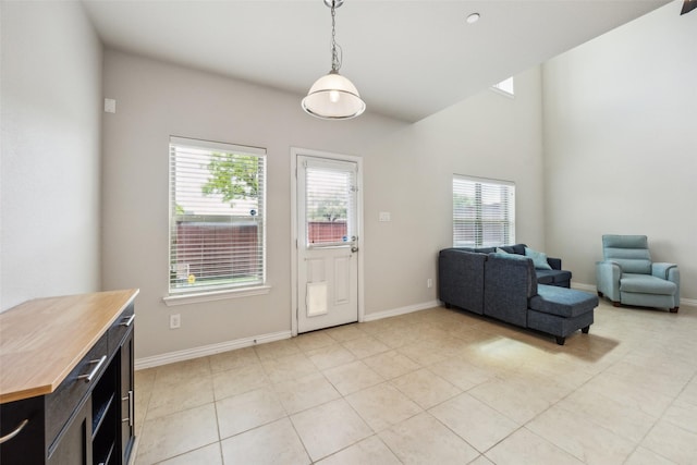 6552 Federal Hall St, Plano, TX 75023 - foyer with healthy amount of natural light, light tile patterned flooring, and baseboards