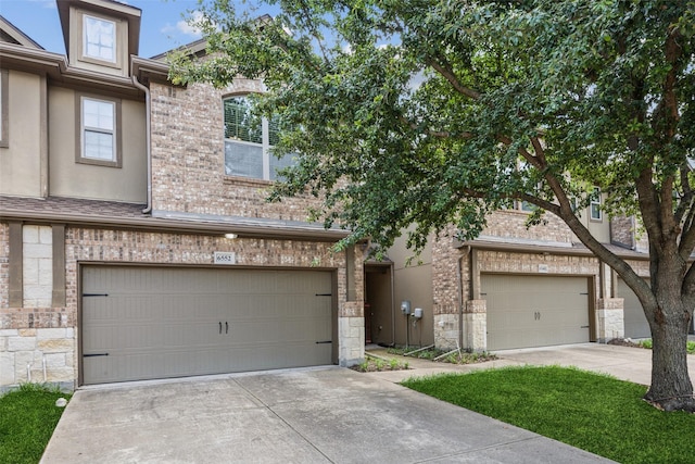 6552 Federal Hall St, Plano, TX 75023 - view of front of home featuring stone siding, driveway, an attached garage, and brick siding