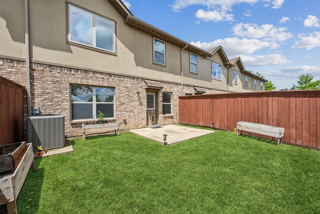 6552 Federal Hall St, Plano, TX 75023 - rear view of house with cooling unit, a patio, stucco siding, and brick siding