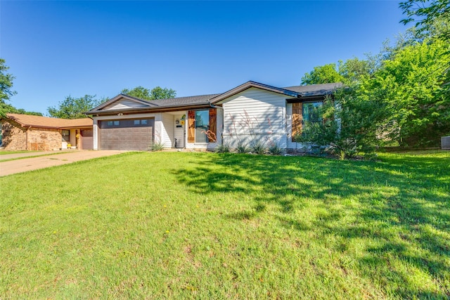 204 Laura Dr, Burleson, TX 76028 - view of front of house featuring an attached garage, a front yard, and driveway