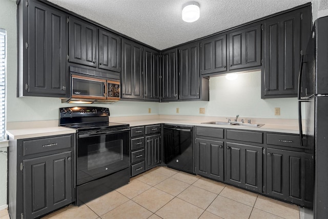 1226 Baylor Ave Unit 116, Waco, TX 76706 - kitchen featuring black appliances, a sink, light tile patterned flooring, light countertops, and a textured ceiling