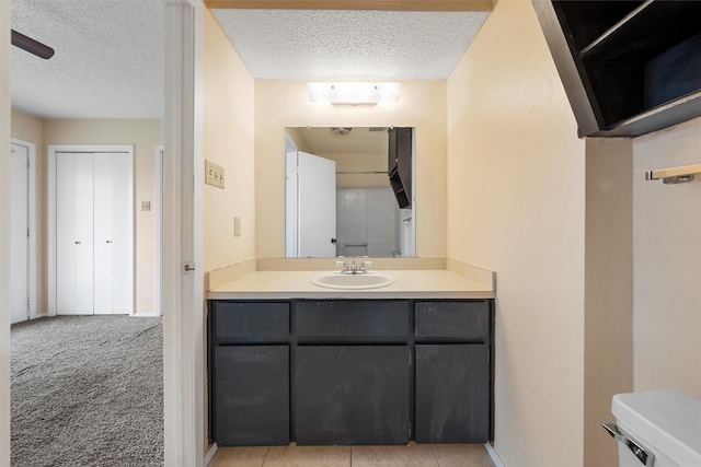 1226 Baylor Ave Unit 116, Waco, TX 76706 - bathroom featuring a textured ceiling, vanity, and toilet