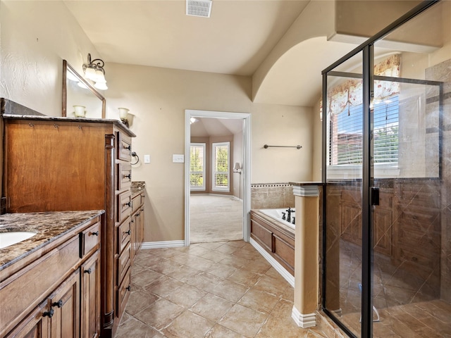 1413 Prairie Dr, Carrollton, TX 75007 - bathroom featuring vanity, a shower stall, a garden tub, and tile patterned floors