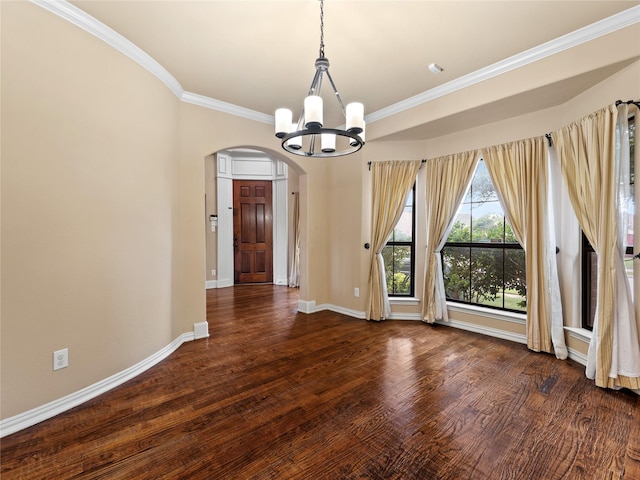 1413 Prairie Dr, Carrollton, TX 75007 - unfurnished dining area with arched walkways, a chandelier, crown molding, wood finished floors, and baseboards