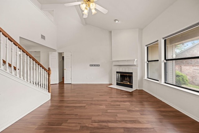 1120 Forest Creek St, Benbrook, TX 76126 - unfurnished living room featuring ceiling fan, stairs, healthy amount of natural light, a tile fireplace, and high vaulted ceiling