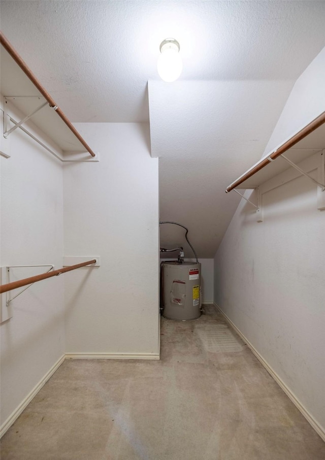 1120 Forest Creek St, Benbrook, TX 76126 - spacious closet featuring electric water heater, lofted ceiling, and carpet floors