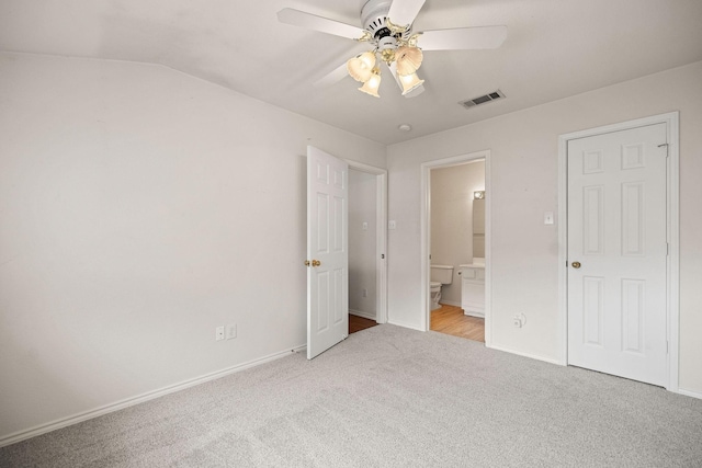 1120 Forest Creek St, Benbrook, TX 76126 - unfurnished bedroom with carpet flooring, baseboards, ensuite bathroom, lofted ceiling, and a ceiling fan