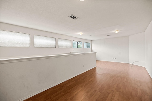 1120 Forest Creek St, Benbrook, TX 76126 - below grade area with wood finished floors and baseboards