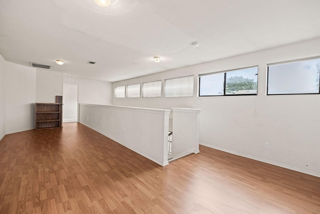1120 Forest Creek St, Benbrook, TX 76126 - basement with wood finished floors and baseboards