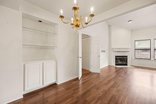 1120 Forest Creek St, Benbrook, TX 76126 - unfurnished living room with a chandelier, wood finished floors, a tile fireplace, and baseboards