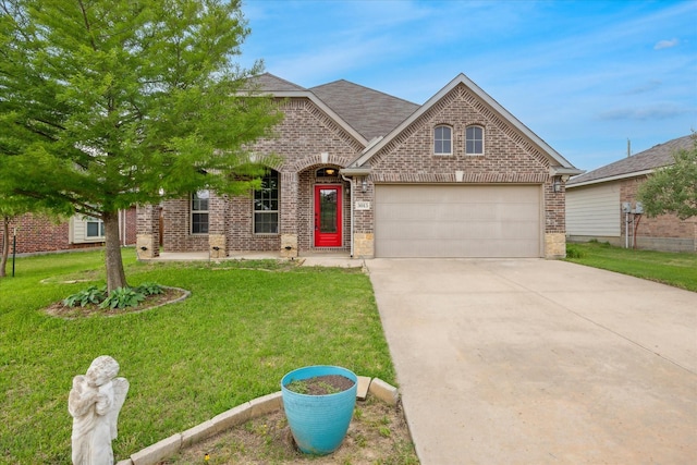 5013 Spruce, Krum, TX 76249 - view of front of home with brick siding, driveway, a front yard, and an attached garage