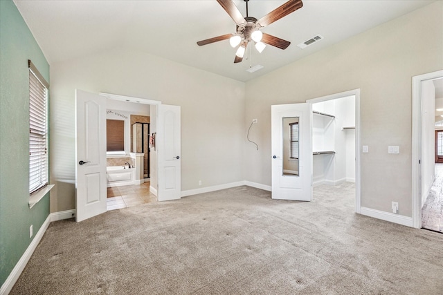 5013 Spruce, Krum, TX 76249 - unfurnished bedroom featuring vaulted ceiling, carpet flooring, a walk in closet, and baseboards
