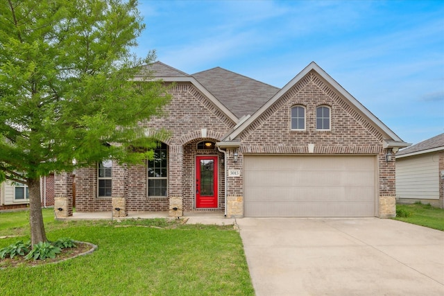 5013 Spruce, Krum, TX 76249 - view of front of property featuring brick siding, a garage, driveway, and a front lawn