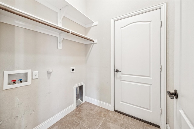 5013 Spruce, Krum, TX 76249 - washroom with hookup for a washing machine, hookup for an electric dryer, baseboards, gas dryer hookup, and light tile patterned floors