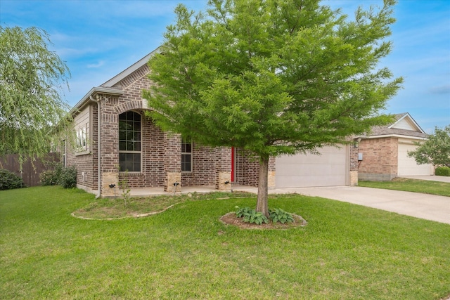5013 Spruce, Krum, TX 76249 - view of front facade with brick siding, driveway, a front yard, and an attached garage