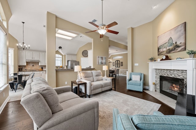 1820 Lacey Oak Ln, Keller, TX 76248 - living room with a ceiling fan, a chandelier, healthy amount of natural light, lofted ceiling, and a tiled fireplace
