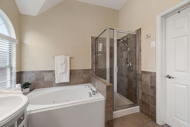 1820 Lacey Oak Ln, Keller, TX 76248 - bathroom with a stall shower, tile patterned flooring, a whirlpool tub, a sink, and tile walls