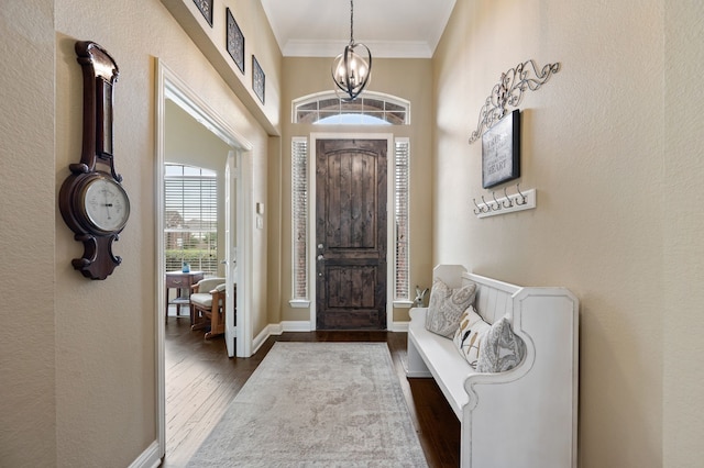 1820 Lacey Oak Ln, Keller, TX 76248 - foyer entrance with dark wood finished floors, crown molding, baseboards, and a chandelier