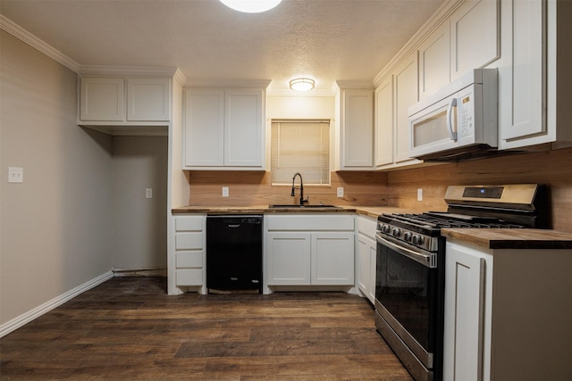 204 E 2nd St, Quinlan, TX 75474 - kitchen featuring black dishwasher, stainless steel range with gas cooktop, white microwave, a sink, and white cabinets