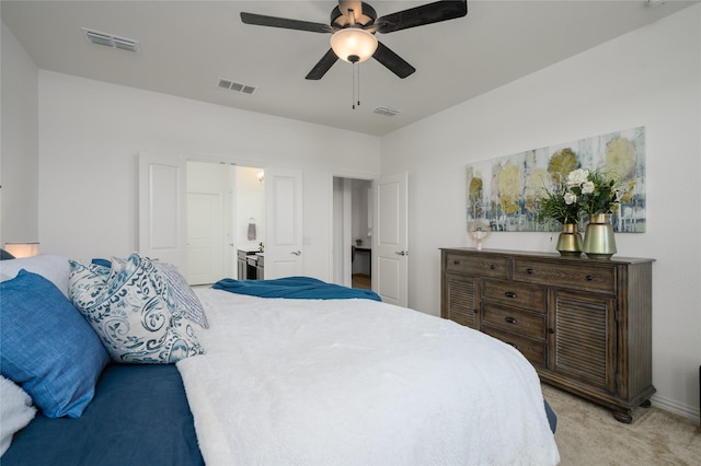 bedroom featuring light colored carpet and ceiling fan