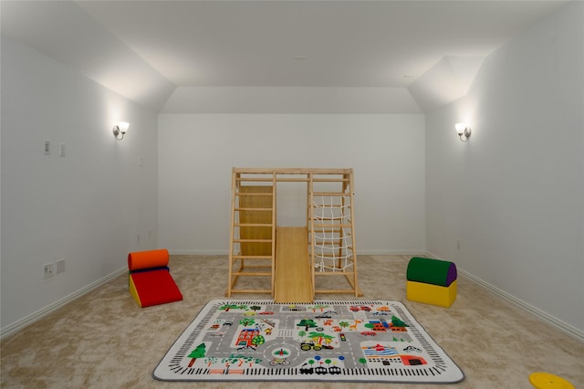 recreation room featuring carpet, lofted ceiling, and baseboards