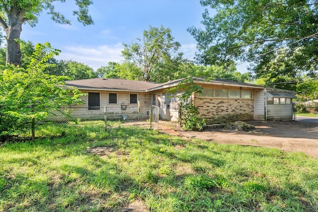 single story home featuring brick siding and fence