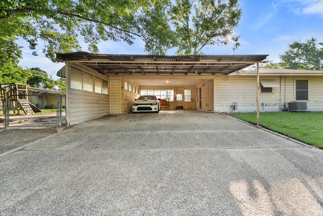 view of vehicle parking featuring driveway and an attached carport