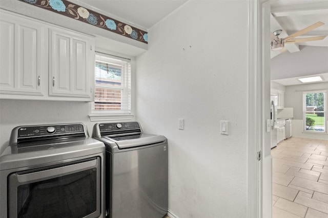 laundry area with cabinet space, washer and dryer, and a ceiling fan