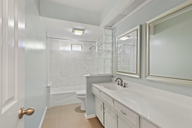 bathroom featuring vanity, toilet, shower / bath combination, and baseboards