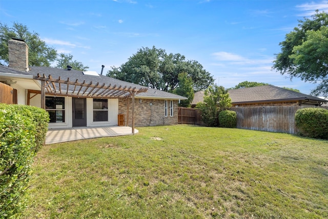 view of yard with a pergola and a patio