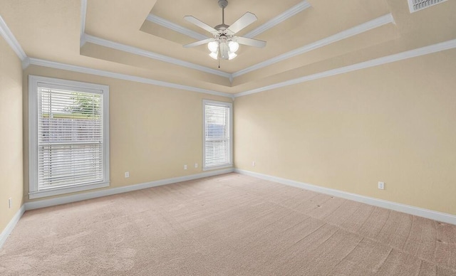 1105 Charing Cross Dr, Waco, TX 76712 - empty room with a raised ceiling, light carpet, a ceiling fan, and crown molding
