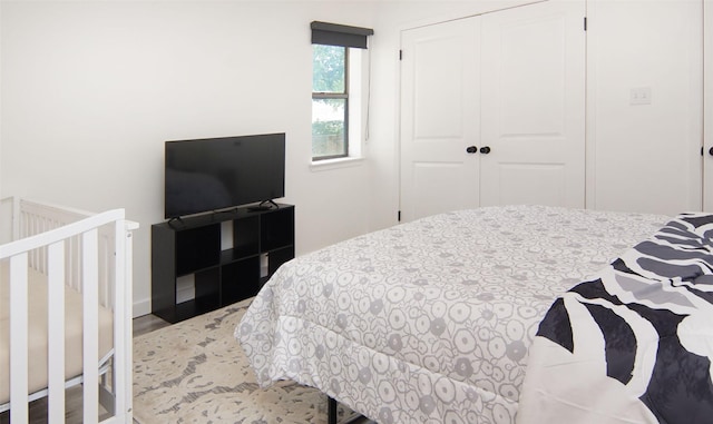1022 Kintner Dr, Graham, TX 76450 - bedroom with a closet and wood finished floors