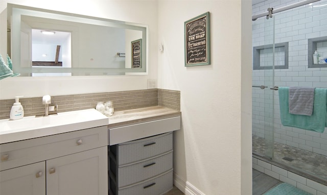 1022 Kintner Dr, Graham, TX 76450 - full bathroom featuring a stall shower, tasteful backsplash, and vanity
